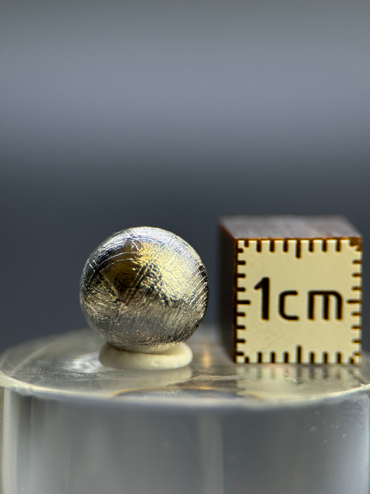 Muonionalusta meteorite, Sweden. 1cm sphere with display.
