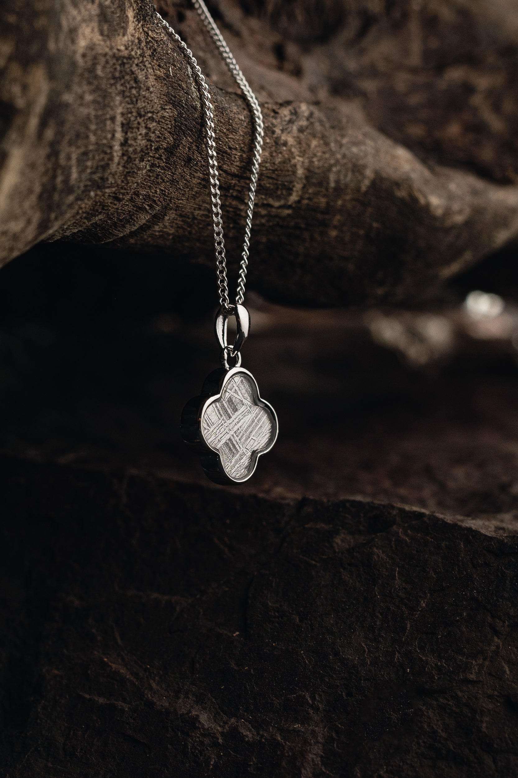 Handcrafted meteorite pendant with silver setting - authentic Muonionalusta meteorite, a celestial style with a genuine meteorite centerpiece. Explore the cosmos with this unique meteorite jewelry piece.